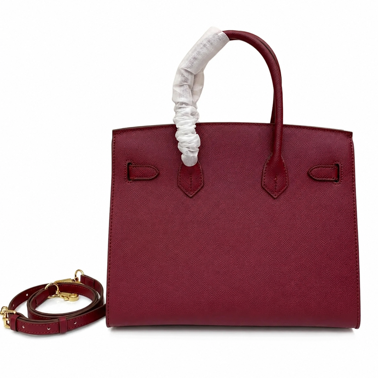 Rich Deep Burgundy Fine Grain Structured Trapezoid Hand Carry Tote With Glossy Luminous Golden Twist Lock Hardware And Matching Suspended Engraved Padlock Charm